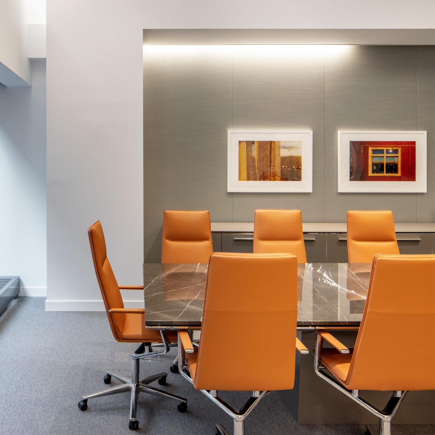 MESA tables in stunning St. Germaine marble and Polished Chrome are paired with custom HALCON credenzas.